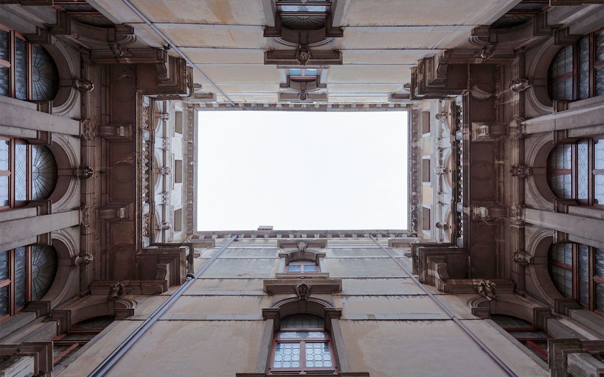 Ca' Rezzonico courtyard view from below, showcasing architectural details in Venice.