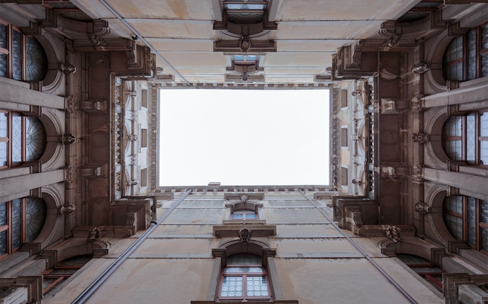 Ca' Rezzonico courtyard view from below, showcasing architectural details in Venice.