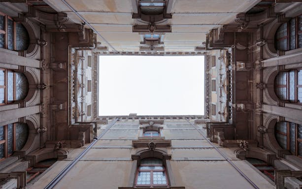 Ca' Rezzonico courtyard view from below, showcasing architectural details in Venice.