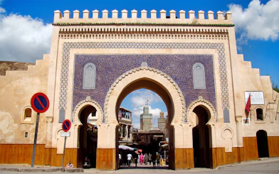 Bab Bou Jeloud gate entrance to Fes Medina, Morocco, with intricate blue tilework.