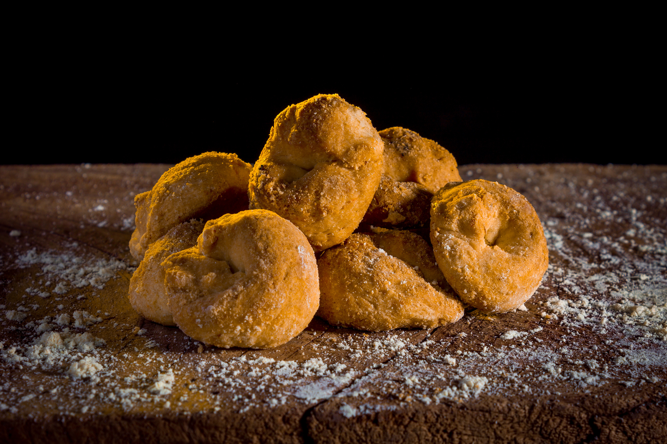 Handcrafted doughnuts displayed at Doughnut Time, featuring a variety of colorful toppings.