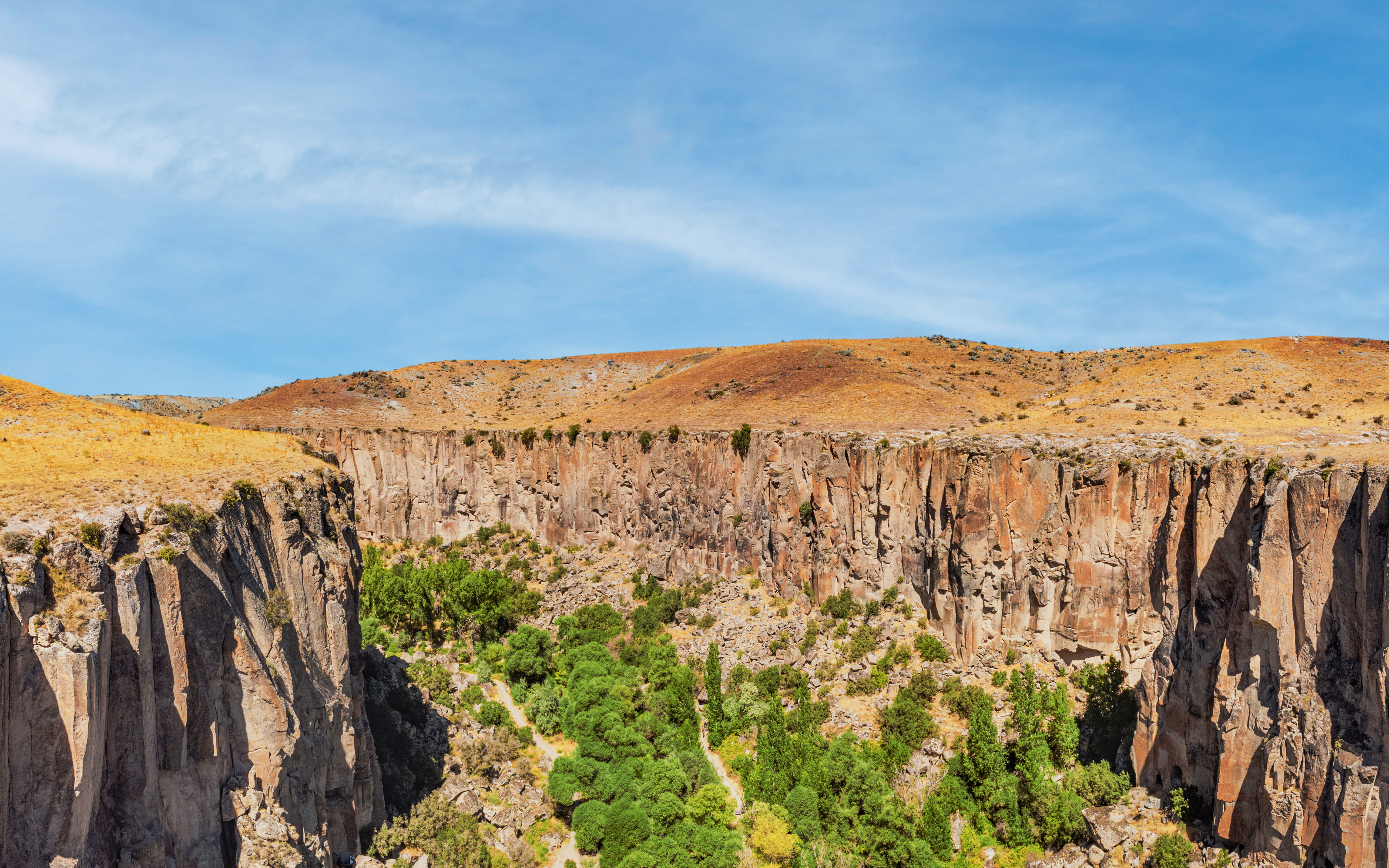 Aerial view of Ihlara Valley's deep gorge and cliffs in Cappadocia, Turkey.