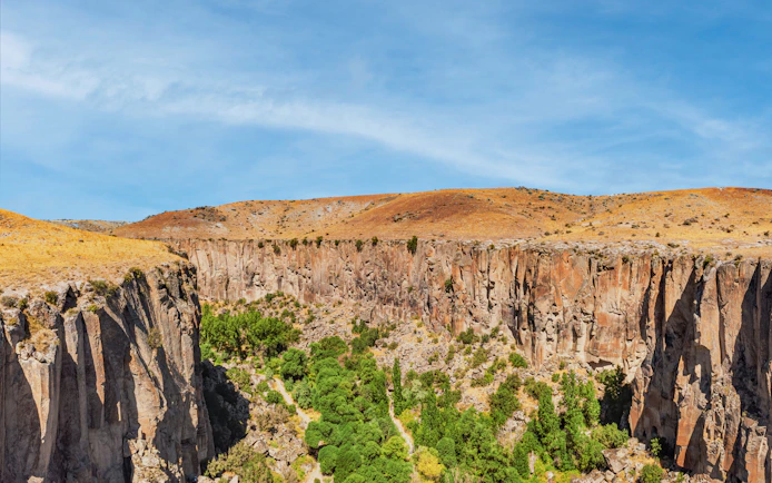 Aerial view of Ihlara Valley's deep gorge and cliffs in Cappadocia, Turkey.