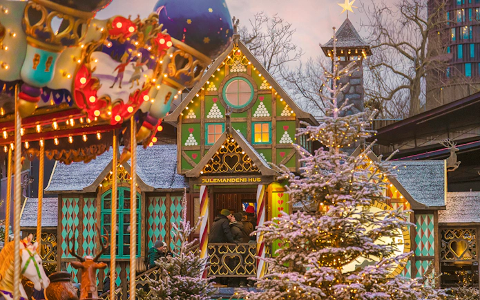 Tivoli Gardens Copenhagen Christmas decorations with carousel and festive lights.