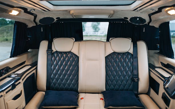 Luxury van interior for 2-way airport seat-in-coach transfers.