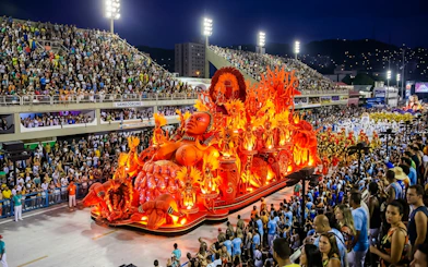 Salgueiro School parade float with vibrant red and orange decorations at Rio de Janeiro carnival.