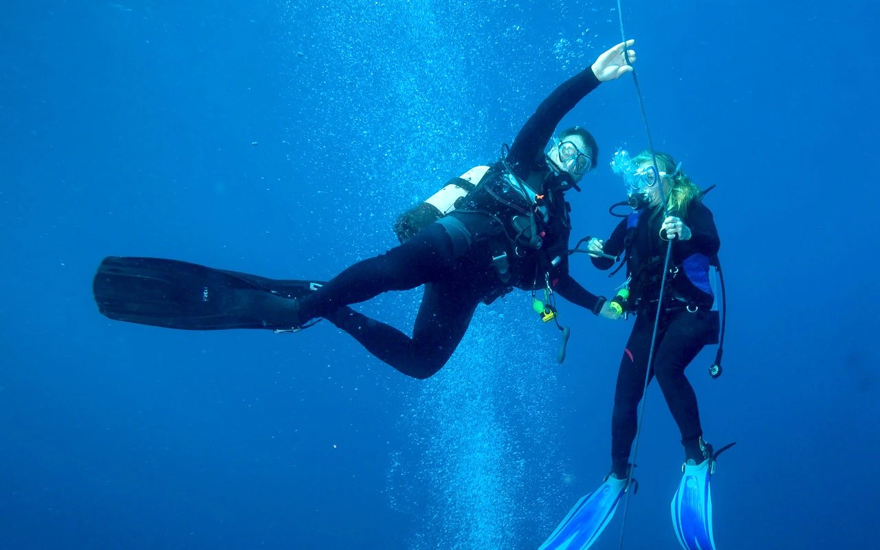 Scuba divers exploring underwater in the Red Sea, Hurghada.