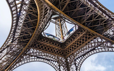Eiffel Tower iron lattice structure viewed from below, Paris, France.