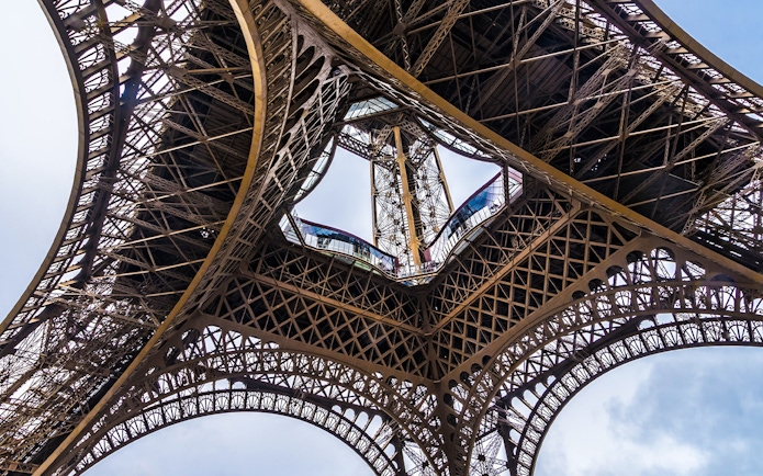 Eiffel Tower iron lattice structure viewed from below, Paris, France.