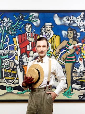 Man posing in front of famous artwork at Centre Pompidou.