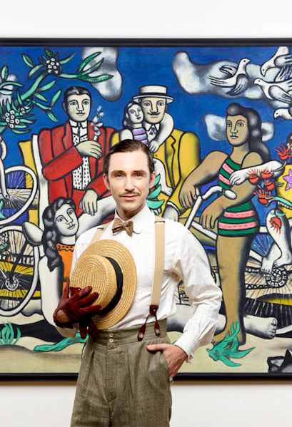 Man posing in front of famous artwork at Centre Pompidou.