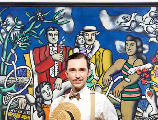 Man posing in front of famous artwork at Centre Pompidou.