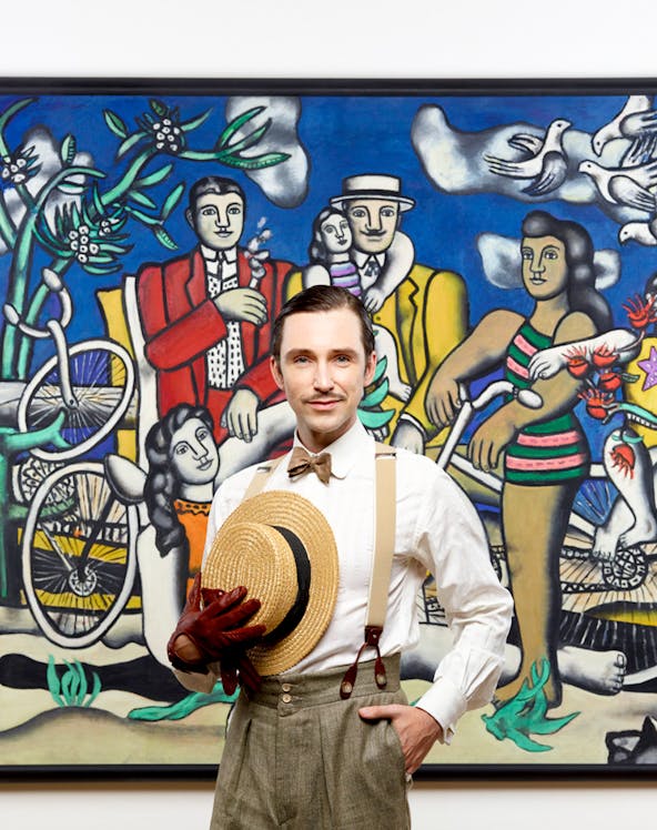 Man posing in front of famous artwork at Centre Pompidou.