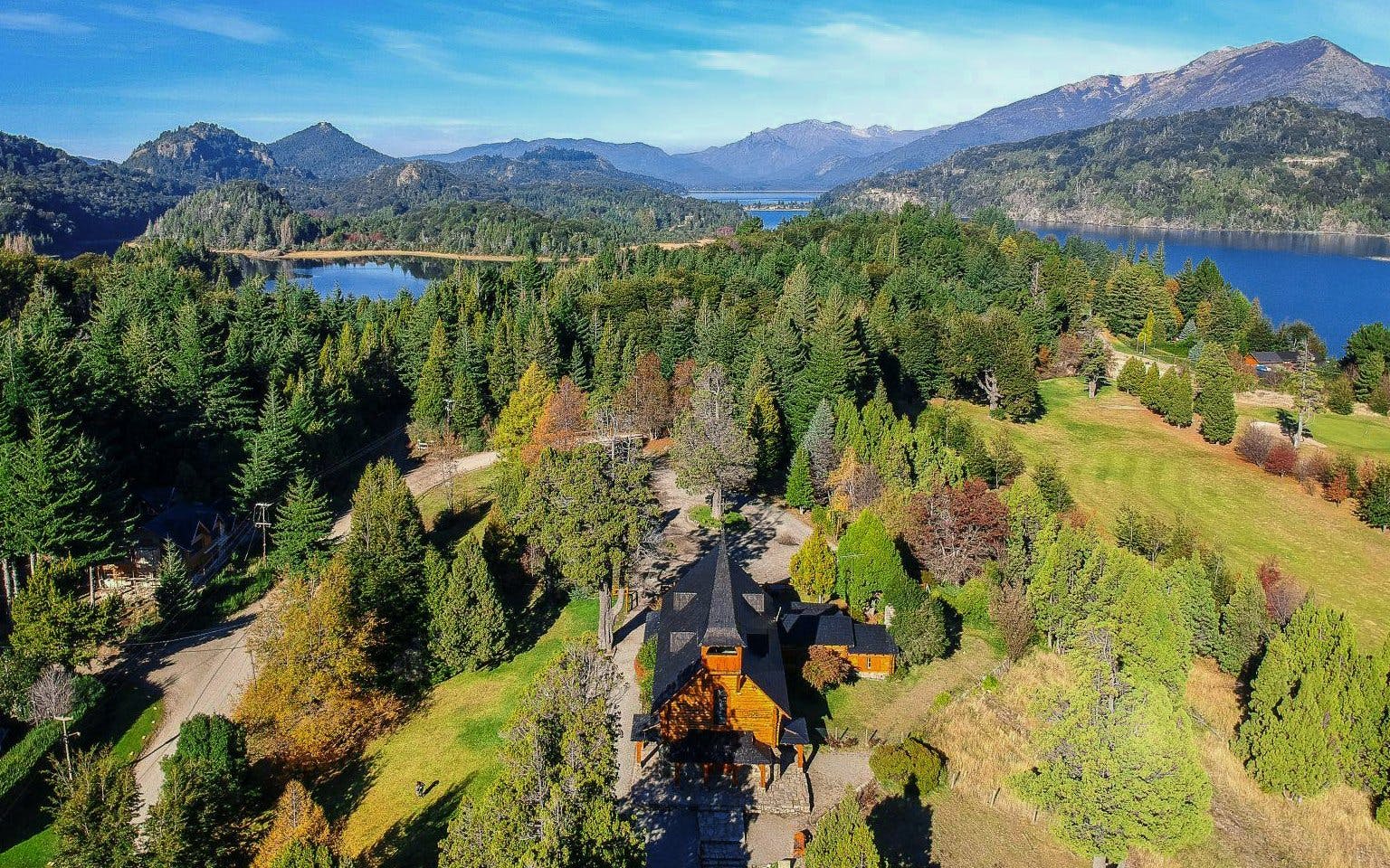 Aerial view of Llao Llao area with lakes, forests, and mountains in Bariloche.
