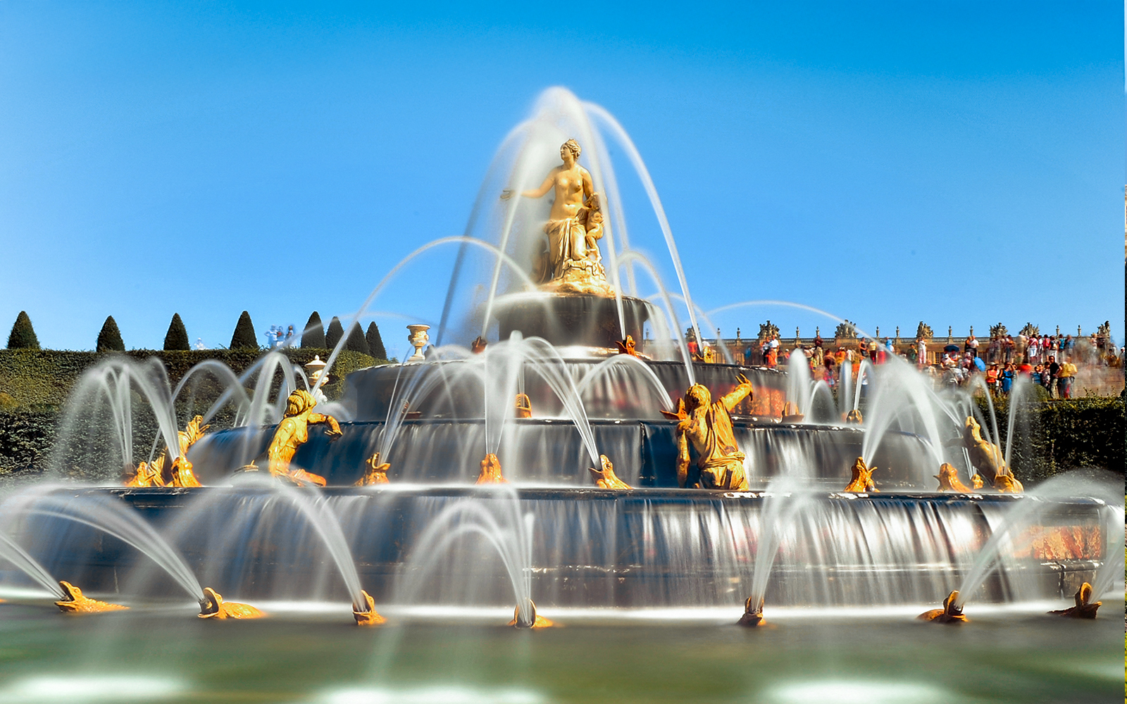 Fountain with sculptures in the Garden of the Palace of Versailles.