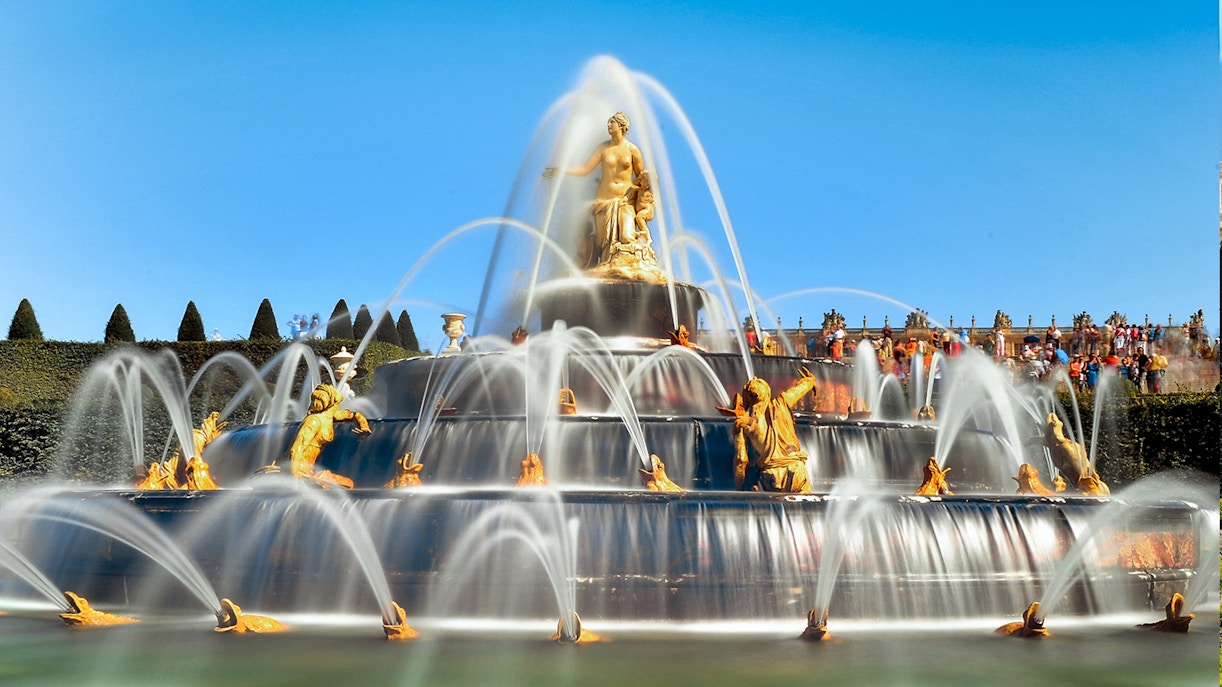Fountain with sculptures in the Garden of the Palace of Versailles.
