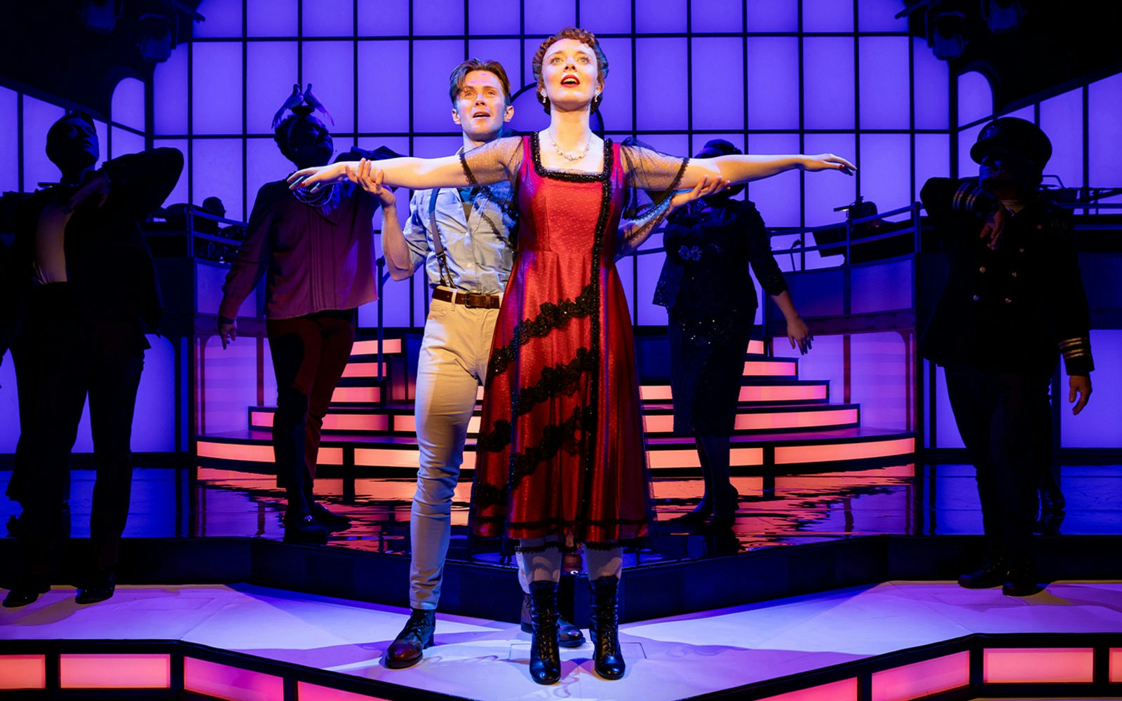 Performers on stage reenacting a scene from the musical Titanique.