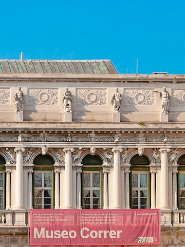 Correr Museum facade with statues and columns in Venice, Italy.