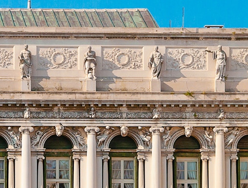 Correr Museum facade with statues and columns in Venice, Italy.