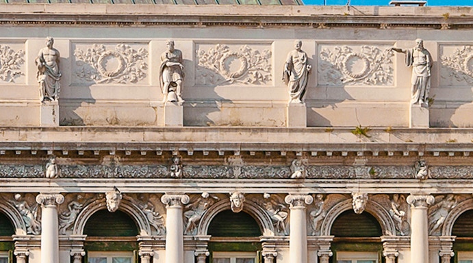 Correr Museum facade with statues and columns in Venice, Italy.