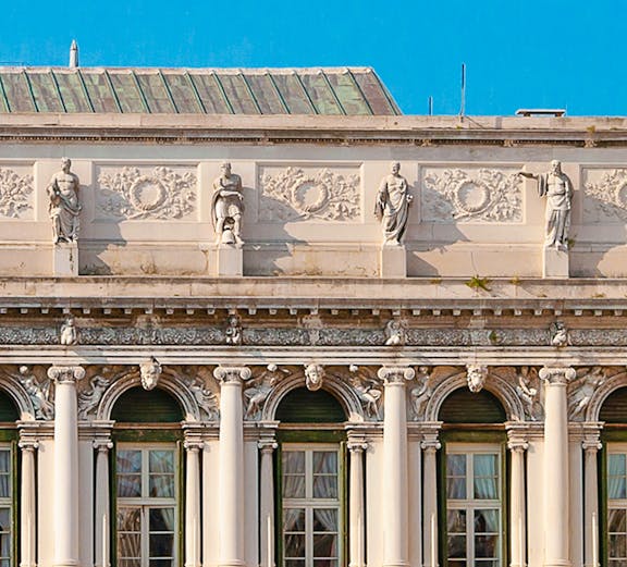 Correr Museum facade with statues and columns in Venice, Italy.