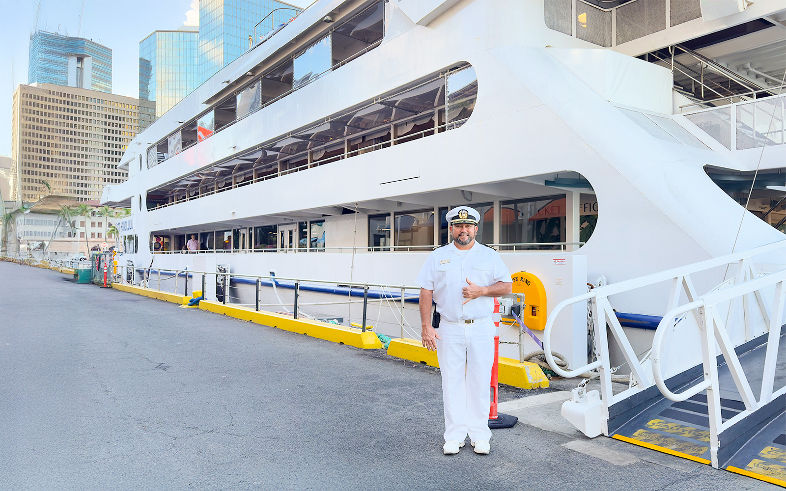 Cruise captain greeting guests at the dock in Oahu, Hawaii.