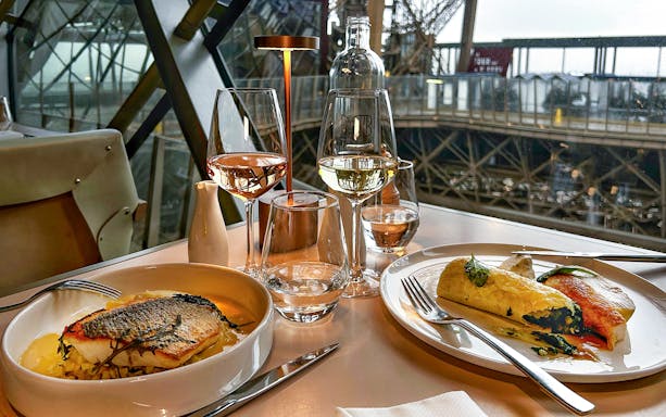 Christmas lunch at Madame Brasserie, Eiffel Tower, Paris, featuring gourmet dishes and wine.