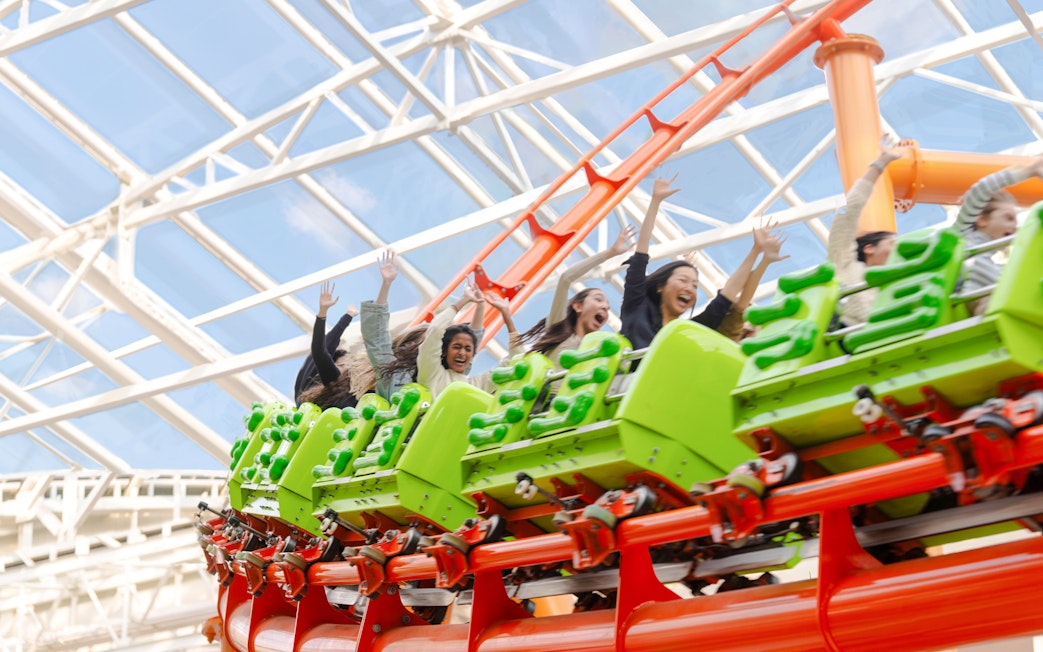 Riders enjoying a roller coaster at American Dream Nickelodeon Universe.