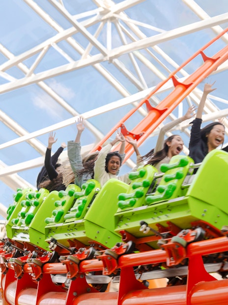 Riders enjoying a roller coaster at American Dream Nickelodeon Universe.