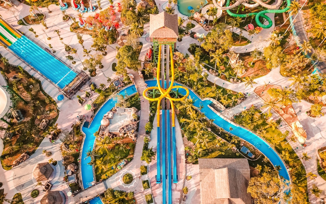 Aerial view of water slides and lazy river at Sun World Hon Thom tropical-themed water park.