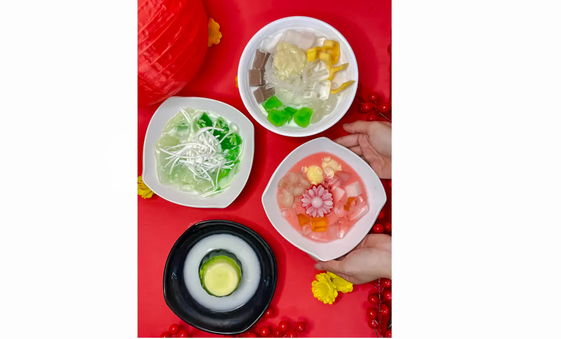 Assorted Vietnamese desserts on a red table during Da Nang street food tour.
