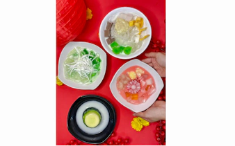 Assorted Vietnamese desserts on a red table during Da Nang street food tour.