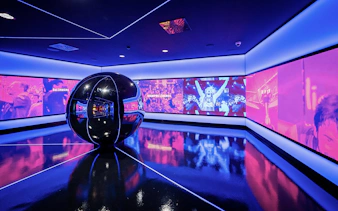 Interactive exhibit at FC Barcelona Immersive Tour with vibrant sports visuals.