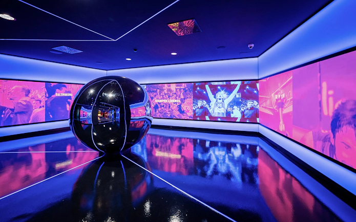 Interactive exhibit at FC Barcelona Immersive Tour with vibrant sports visuals.