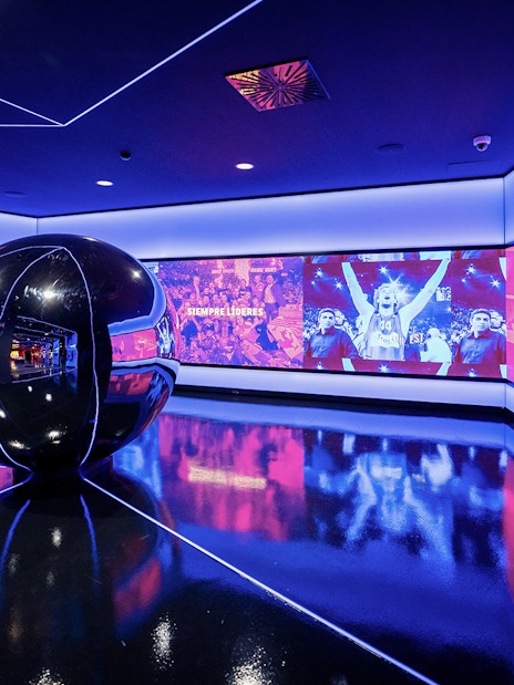 Interactive exhibit at FC Barcelona Immersive Tour with vibrant sports visuals.