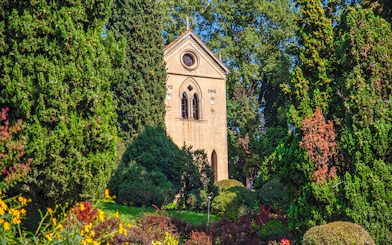 Hermitage of Laura surrounded by lush greenery at Parco Giardino Sigurtà.