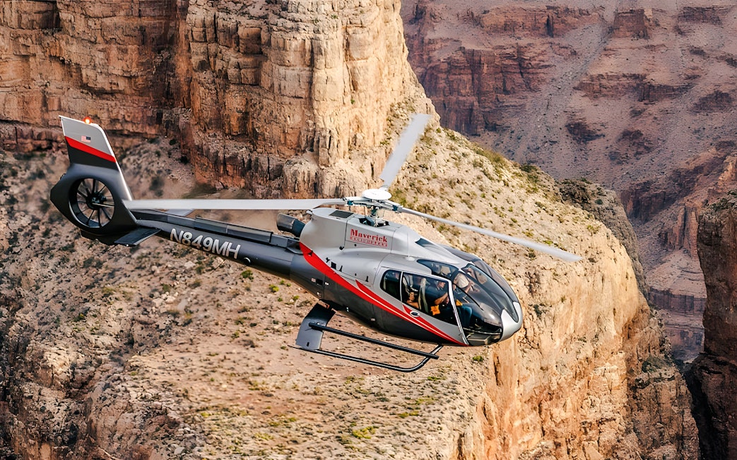 Maverick Helicopters Airbus EC130 flying over the Grand Canyon.