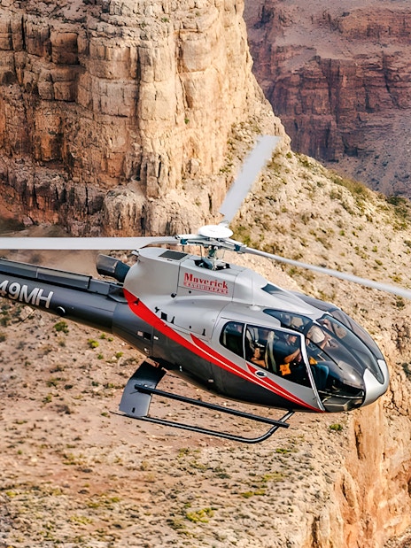 Maverick Helicopters Airbus EC130 flying over the Grand Canyon.