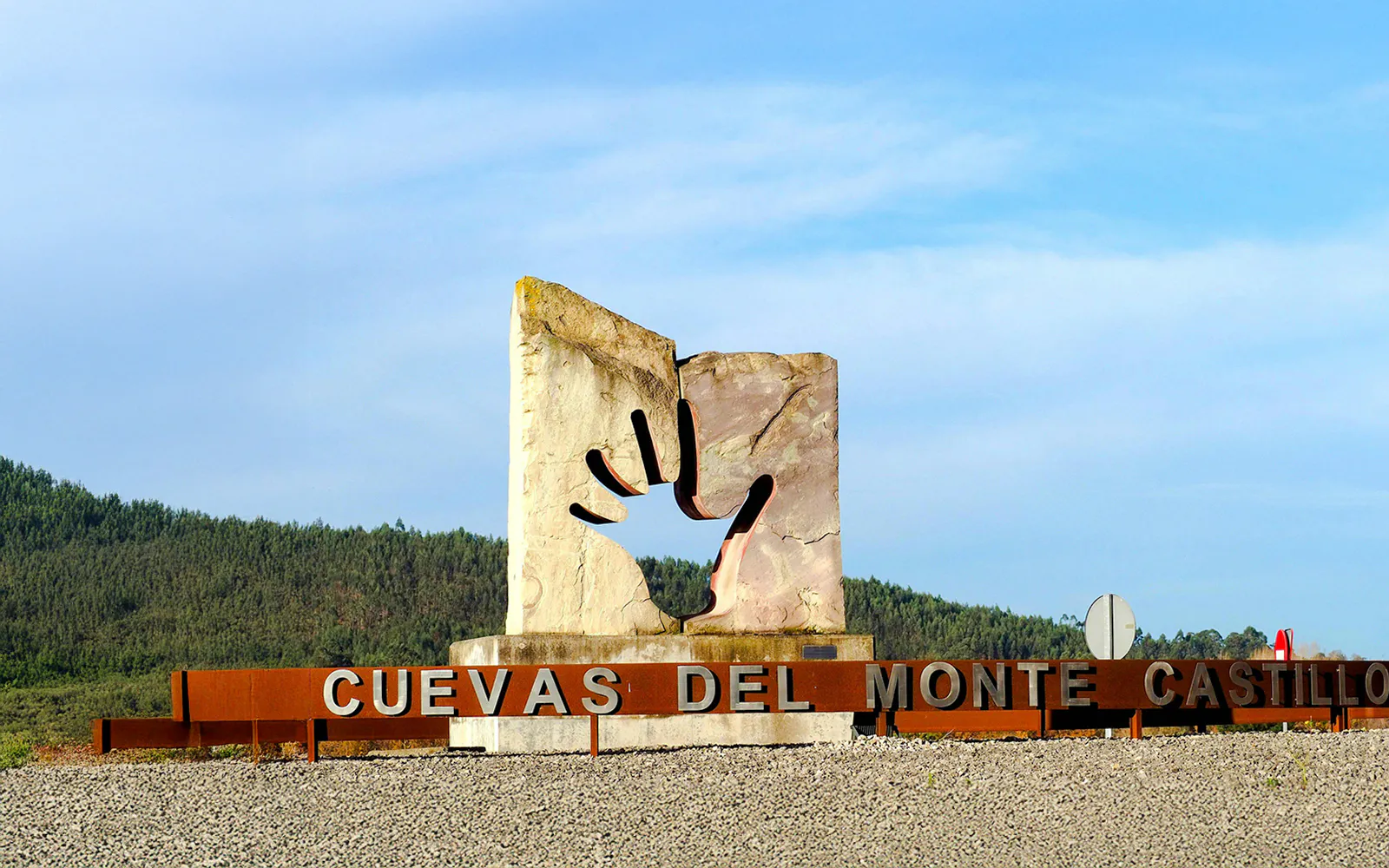 Monument at the entrance to Cuevas del Monte Castillo, Puente Viesgo, Cantabria, Spain.