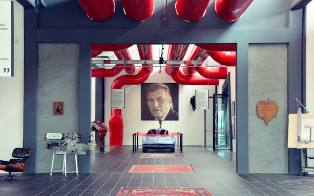Ferruccio Lamborghini Museum interior with car display in Bologna, Italy.