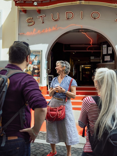 Tour group outside Studio 28 in Montmartre during Sacré Coeur walking tour.