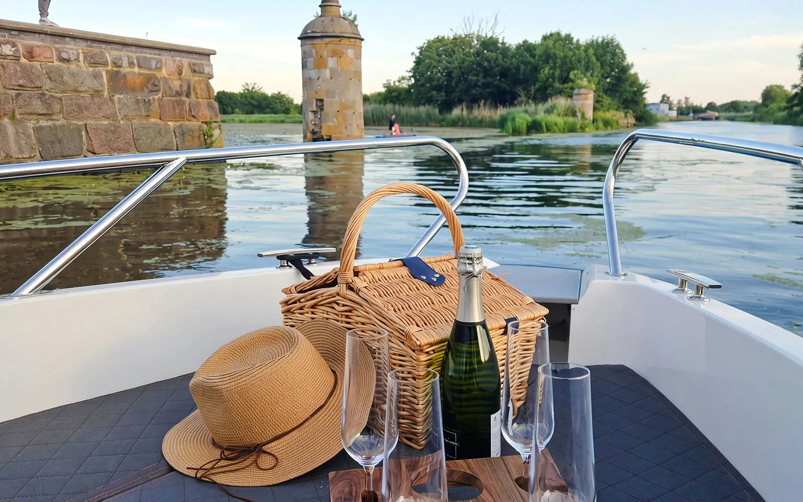 Wine and picnic basket on boat during Gdańsk Motława Sunset Cruise.