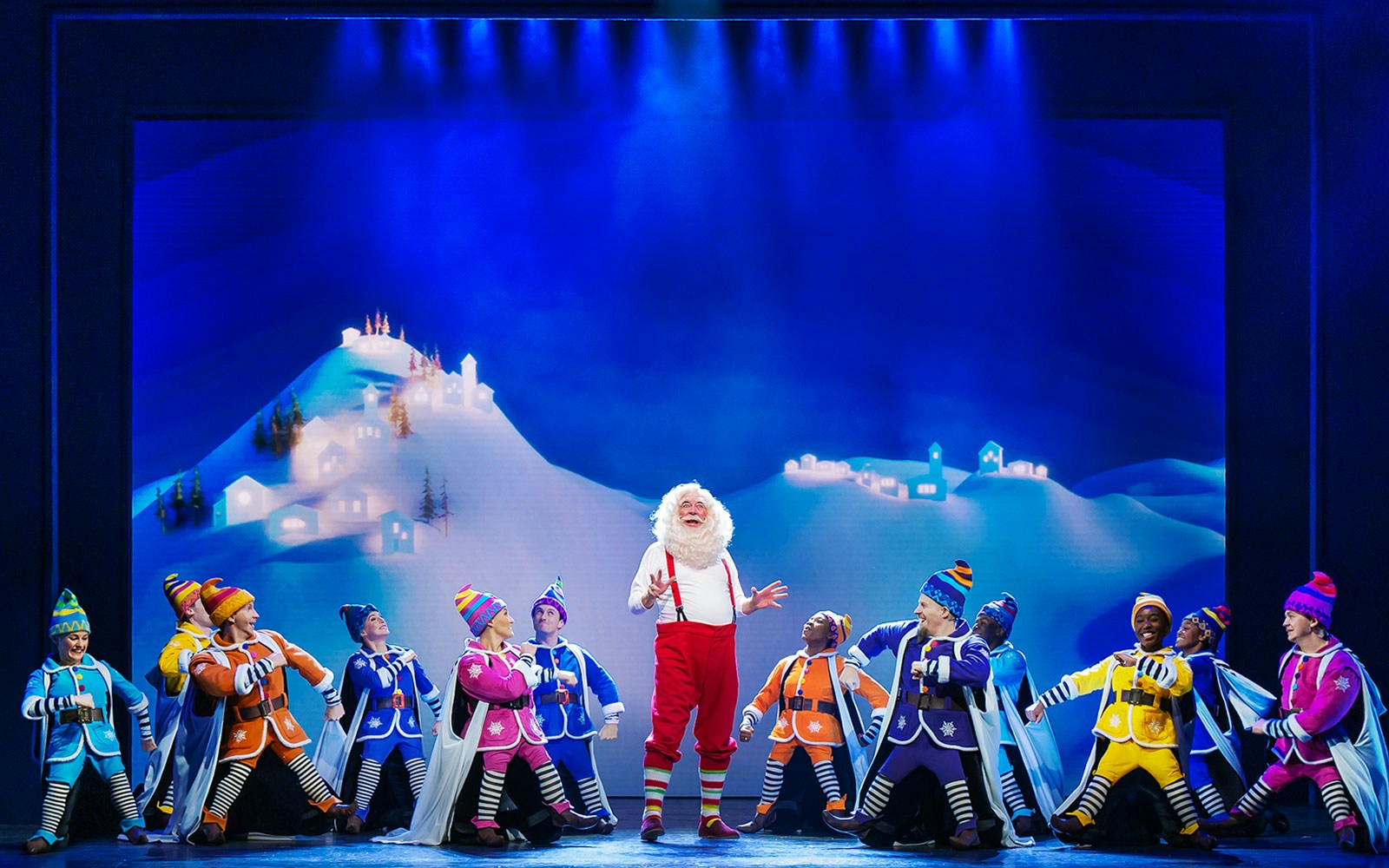 Elf The Musical stage performance with actors in festive costumes at a New York City theater.