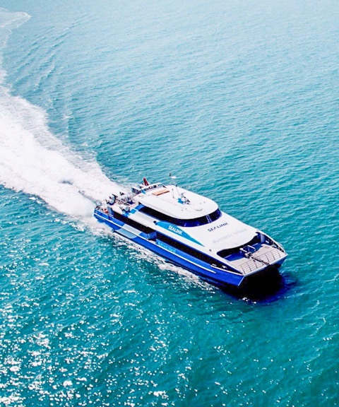 Ferry departing Rottnest Island towards Perth or Fremantle across the ocean.