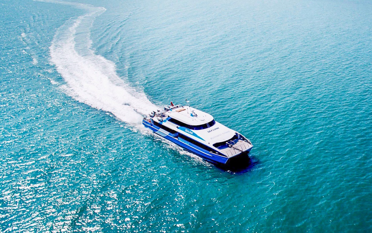 Ferry departing Rottnest Island towards Perth or Fremantle across the ocean.