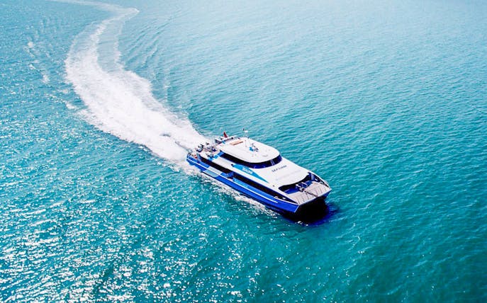 Ferry departing Rottnest Island towards Perth or Fremantle across the ocean.