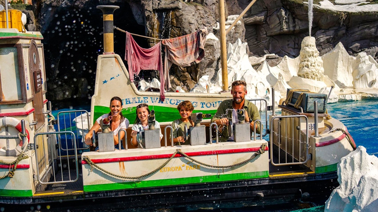 Family enjoying a whale watching boat ride at Europa Park's Northern Light adventure.