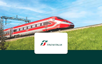Trenitalia Frecciarossa train traveling through the countryside.