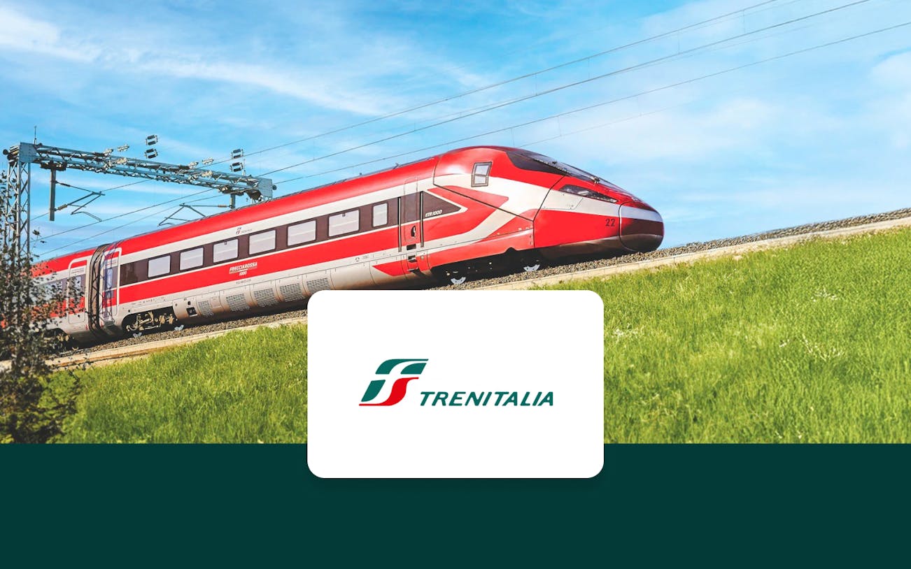 Trenitalia Frecciarossa train traveling through the countryside.