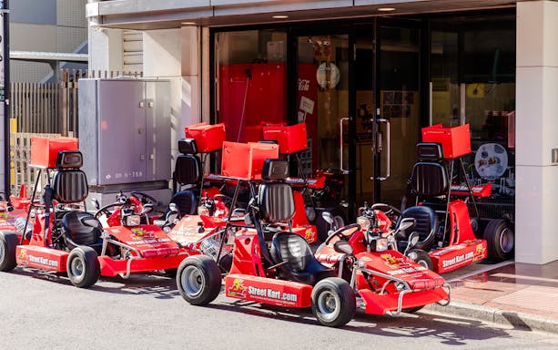 Go karts lined up for Shibuya Go Karting experience in Tokyo street.